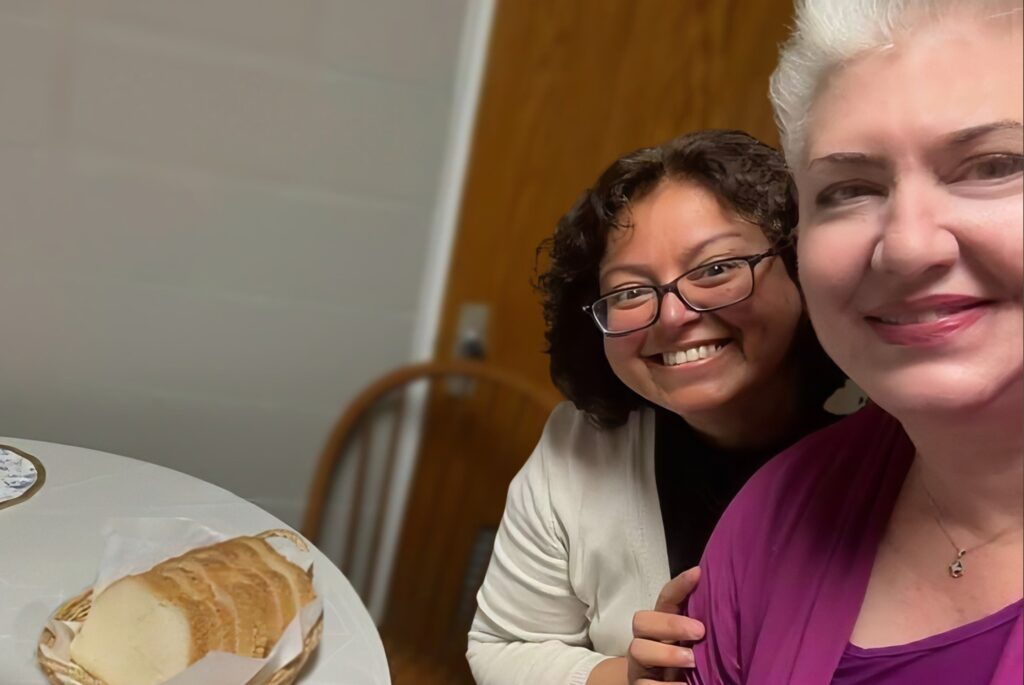 Ana and Holly sitting at a table